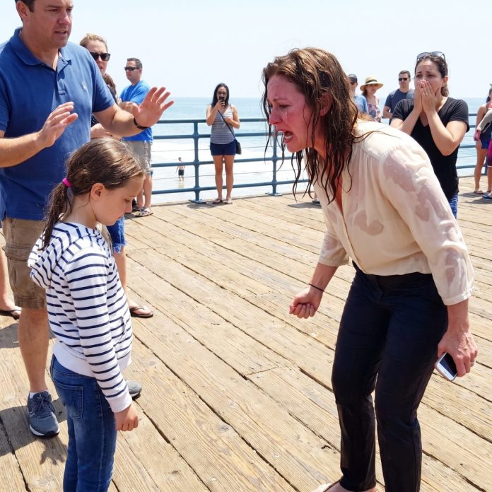 Mother_confronts_daughter_on_beach_202607100049