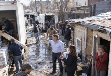 One desperate gesture from a homeless girl changed everything. She grabbed the hand of a wealthy man… and less than 24 hours later, a fleet of luxury cars arrived at her old shack.