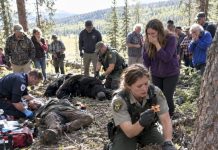 The villagers were already crying when they arrived, convinced the worst had happened. Then they saw what was really going on beside the bear, and the shock spread through the crowd.