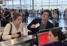 “Economy suits you,” my brother smirked as he held up his first-class ticket like he had already won. I said nothing and handed the agent my ID, but seconds later an alarm sounded, the screen turned red, and his smug expression disappeared completely.