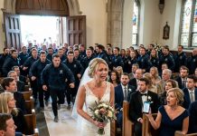 The night before my wedding, Mom called all 94 guests and told them, The whole family agrees we’re not going. Don’t be the only one there. On my wedding day, I started walking down the aisle alone—until the back doors suddenly opened and 200 strangers in matching jackets walked in. The pastor froze. Then Mom’s phone buzzed: Turn around. Your daughter’s groom is…