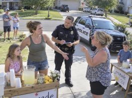 My neighbor actually called the police on my seven-year-old because her lemonade stand was getting more customers than her son’s. I thought she was bluffing—until a patrol car pulled up in front of our house and she stood there looking completely satisfied.