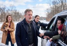 I was headed to a “family dinner” with my daughter. In the snowstorm, i spotted a homeless young woman clutching a tiny, badly shivering dog. i stopped. “get in. you’ll freeze out here.” she climbed into my back seat, shaking. 5 minutes later, police suddenly stopped my car because…