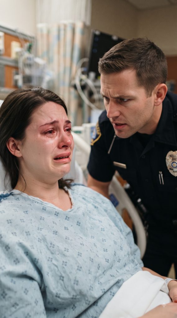 Police_officer_comforting_grievi…_2K_20260921221640