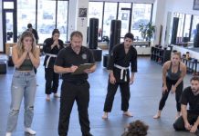 “Let me teach you how to survive a real fistfight, sweetheart!” my sister’s ex mocked, stepping onto the dojo mat. He threw a heavy punch with all his weight. In less than a second, I pinned him flat against the mat with his own arm locked. The gym froze. The black-belt master chief checked the combat roster, horrified. “Everyone, clear the room right now… She is the classified unarmed-combat trainer for Delta Force.” He could not even stand up…