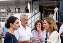 At our mother’s birthday dinner, my older sister bragged that her husband earned more in ONE MONTH than I made in A YEAR—then laughed at my simple dress. I smiled and thanked her. The following weekend, as our family boarded their luxury cruise, the captain personally welcomed me: “Ma’am, your PRIVATE OWNER’S SUITE is ready.”