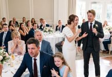 At my brother’s wedding, he mocked me for being a single dad and said no woman would ever want me. Everyone laughed—even our parents. Then the bride slowly stood, reached for the microphone, and the room went completely silent.