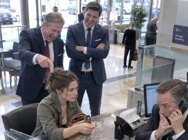 My billionaire grandfather left millions to my family. I got just $2. Dad and my brother couldn’t stop laughing. “That’s all you’re worth!” I said nothing. I turned the bill over. There was a strange little mark on the back. The bank manager saw it and went pale. He picked up the phone. “Sir… she’s here.”