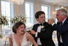 My husband grabbed my hair at our luxurious reception. Then came three slaps—and his shout: “Without me, you’re nobody!” The entire ballroom went silent. A man rose from the head table, pressed a gun to his temple, and growled, “How dare you touch my daughter?” My husband’s face drained of color. He didn’t know who my father really was. And he had no idea what we were about to take from him next…