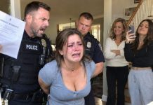 “You’re under arrest for estate fraud.” It was 1:47 a.m., and two cops had just kicked in my door with a warrant. My parents smiled behind them. My sister livestreamed it all—over 1 million people watching. I didn’t resist. But at the station, an officer froze the moment he opened my file, then stepped aside to whisper. Fifteen minutes later, the chief entered with a trembling voice: “Ma’am… You are…”