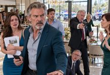 At my daughter’s housewarming, her father-in-law stopped me as I prepared to speak. “Sit down. Someone like you doesn’t belong here.” Everyone became silent. I smiled, lifted my phone, and said, “Freeze the position. Freeze all of it.” His face gave away everything. The perfect revenge…