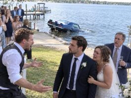 They expected me to fall apart when my brother sent my classic car sinking into the lake in front of everyone at my wedding. Instead, I calmly asked one question: “Are you absolutely sure you checked the trunk first?” My father’s smile disappeared before my brother even answered.