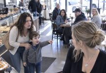 My five-year-old son pointed at a woman in the bakery and whispered, “Mommy, she comes to our house when you’re working. She plays in your bedroom.” After ten years of marriage, I felt my entire world collapse. I walked toward her, ready to confront my husband’s mistress. Then I saw her necklace. I recognized it immediately—and suddenly, everything was far worse than I imagined.