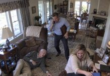 On my way home, I learned my 102-year-old father had been rushed to the ER. My wife told me, “I’m already there. Don’t rush.” But when I arrived, the nurse stared at me and said, “You’re the first family member here.” That night, I checked the security footage—and what I saw made my blood run cold.