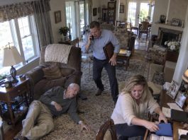 On my way home, I learned my 102-year-old father had been rushed to the ER. My wife told me, “I’m already there. Don’t rush.” But when I arrived, the nurse stared at me and said, “You’re the first family member here.” That night, I checked the security footage—and what I saw made my blood run cold.