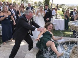 My entire family burst out laughing when I walked into my sister’s wedding alone, and my father humiliated me in front of everyone before shoving me straight into the fountain. Soaking wet, I looked him in the eye and said, “Remember this moment”—because twenty minutes later, the man I had secretly married arrived, and suddenly nobody was laughing.
