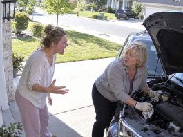 I caught my MIL under the hood of my car, deliberately damaging the brakes, and she never realized I had seen everything. That night, a detective arrived with one horrifying sentence: “The car plunged off the cliff with a man and a woman inside.” Her reaction revealed more than any confession could have.