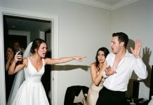 On our wedding night, my husband secretly slipped into another hotel room to sleep with my bridesmaid. Instead of confronting them, I texted both families the room number: “There’s a special surprise gift inside! Come livestream the door opening!” Everyone rushed to the room, excited to see what was waiting. But the moment they opened the door, they screamed in absolute shock…