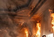 On our wedding night, my husband left me trapped beneath a burning chandelier to rescue his sister-in-law. Then I saw them kissing outside. They believed the fire would silence me forever. But I survived, and six words exposed the secret they’d desperately tried to hide: “Check the cameras beneath the ballroom.”