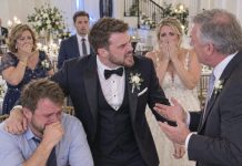 I arrived at my younger brother’s wedding feeling proud after spending years raising him all by myself. But when I found my place card, my heart sank. It read, “Uneducated brother living off the groom.” The bride’s family burst out laughing as I stood there humiliated. I was about to walk away when my brother suddenly stood up, grabbed my arm, and turned toward his future father-in-law. “You just made the most expensive mistake of your life,” he said. The laughter stopped instantly. But my brother wasn’t finished. And judging by the look on his face, what he’d said was only the beginning.