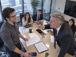 My manager threatened to demote me in front of the entire team, clearly expecting me to panic and beg him to reconsider. Instead, I smiled and told him to hand me the paperwork, because the moment he did, the company would owe me eight figures.