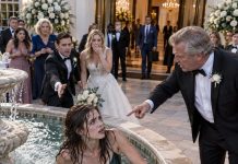At my sister’s wedding, my father laughed at me for arriving without a partner before deliberately pushing me into a freezing fountain in front of our entire family, turning what should have been a celebration into the most humiliating moment of my life. I climbed out soaking wet without saying a word, and while he continued laughing with the guests, he had absolutely no idea who was about to arrive or why their presence would make him regret every second of what he’d done.