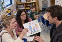 My son’s kindergarten teacher asked me to stay behind after pickup, then quietly slid a family drawing across her desk that made my stomach drop. It showed me, my husband, our little boy, and a blonde woman I had never seen before—and what my son said about her revealed a secret my husband had been hiding right under my nose.