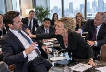 “Your role no longer aligns with our future,” the CEO announced in front of six executives from the company buying us, clearly expecting me to leave humiliated. I didn’t argue or beg—I simply placed my business card on the table, and the moment she read my new title, her confident smile disappeared.