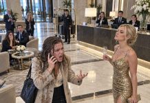 A rude woman in a gold dress dumped champagne all over my plain coat in my own hotel lobby, bragged that her fiancé ran the place, so I called him and said, “Come down now.”