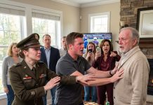 “One rule. No war stories from her,” my aunt announced, tapping her glass before 34 Super Bowl guests. “Four Christmases she skipped. She doesn’t get the floor.” I answered, “I didn’t come to talk, Aunt Linda.” The pregame turned quiet. Onscreen, a linebacker stood beside a man in a wheelchair. He raised a photograph. “See? Real heroes,” my aunt said, waving at the screen. Without a word, Grandpa stood. She dropped the remote.