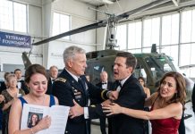My stepmother told me, “Don’t get in the pictures. And don’t mention the Army. The general is here for the museum, not you.” Three hundred guests stood beneath the hangar lights around a restored Huey. I nodded and waited by the back wall beside the oldest display case. The general posed with her, then glanced behind me, setting down his glass. “How long has she been standing there?”