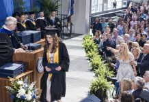 At my graduation ceremony, my sister stood up and shouted, “She cheated her way through college!” The entire auditorium stared. I walked to the podium, accepted my diploma, and… whispered to the dean… who smiled and nodded.