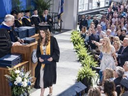 At my graduation ceremony, my sister stood up and shouted, “She cheated her way through college!” The entire auditorium stared. I walked to the podium, accepted my diploma, and… whispered to the dean… who smiled and nodded.