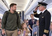 My seven-year-old daughter and I were told to give up our first-class seats for a wealthy businessman and “move to the back,” as though that was where people like us belonged. I didn’t argue. I took my daughter’s trembling hand, lifted my bag, and started down the aisle. Then the cockpit door opened. The captain stepped out, looked at me, and froze. A second later, he straightened and raised his hand in a crisp salute. The entire cabin went silent.