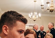 At our engagement dinner, my sister mocked me to his military family: “Basic training chewed her up in 19 days.” They all laughed while I sat there heartbroken, keeping my silence. As he passed me the bread, his thumb brushed my wrist and turned it over to read the back. He put the bread down, froze, and quietly said: “Excuse me. I need to make a call.”