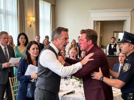 Her uncles demanded an apology, barred the banquet hall doors, and left my 22-year-old daughter alone at the center table. Sixty guests watched. “Nobody leaves until she apologizes to the family.” I stood at the bar, peeling the label off my beer. “Sir, aren’t you going to do something?” the bartender whispered. I answered, “I’m counting exits. Seven.” My daughter looked over. I tapped my glass twice…