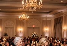 My heart completely shattered at my son’s wedding when his new mother-in-law dropped my name card in the trash, sneering: “A real guest needs that seat.” 150 guests went dead silent while my son froze. I didn’t argue—I just smiled and walked out. 40 minutes later…