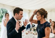 At my daughter’s wedding, her groom suddenly poured champagne over my head right in front of her. Everyone froze, but I didn’t lose my temper or say a word. I simply wiped my face, pulled out some documents, and revealed the secret he’d been desperately hiding. The moment he saw those papers, his face turned pale, and he started begging me…