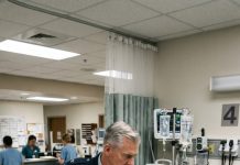 Bed four, surgical ward. Staff Sergeant Diaz had been unconscious for six long days. The moment he opened his eyes, he asked for me, so I flew fourteen hours straight to his side. But the Colonel dragged me up by the arm, laughing coldly: “Save it, Marine.” With his weak, trembling voice, Diaz reached for me and whispered: “Sir… check the hallway first.”