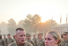 At 0630 under 94-degree heat, 140 soldiers rolled their sleeves, but mine stayed down. “Rules apply to you too, Sergeant. Roll them. Now,” the First Sergeant ordered sharply. With my eyes front, I slowly rolled them up, unable to hide the painful truth. He went deathly white, and the laughter in the ranks instantly died into complete silence…