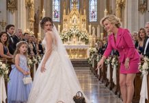 “My future mother-in-law covered the train of my wedding dress with tiny suitcases because I already had a seven-year-old daughter—and when my fiancé realized what she had done, his reaction left the entire ceremony speechless.