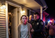 At 1:47 a.m., two police officers kicked down my door with a warrant. “You’re under arrest for estate fraud,” they announced. My parents stood behind them, smiling, while my sister livestreamed the entire nightmare to over one million viewers. I didn’t argue or resist. I quietly went with the officers. But when we reached the police station, one officer opened my file, suddenly froze, and stepped aside to whisper something. Just fifteen minutes later, the police chief appeared in front of me and said, “Ma’am, you are…”