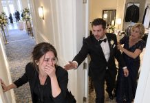 My fiancé died six weeks before our wedding, and I stood beside his mother as we buried him in a closed casket. Three months later, she spotted me working at another wedding and immediately tried to disappear. I followed her to the groom’s room… and what I saw through that half-open door made me question everything about his funeral.