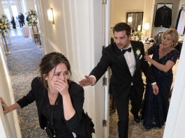 My fiancé died six weeks before our wedding, and I stood beside his mother as we buried him in a closed casket. Three months later, she spotted me working at another wedding and immediately tried to disappear. I followed her to the groom’s room… and what I saw through that half-open door made me question everything about his funeral.